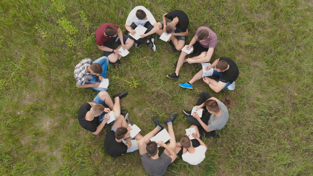Teamwork,concept.,a,group,of,high,school,students,sit,on